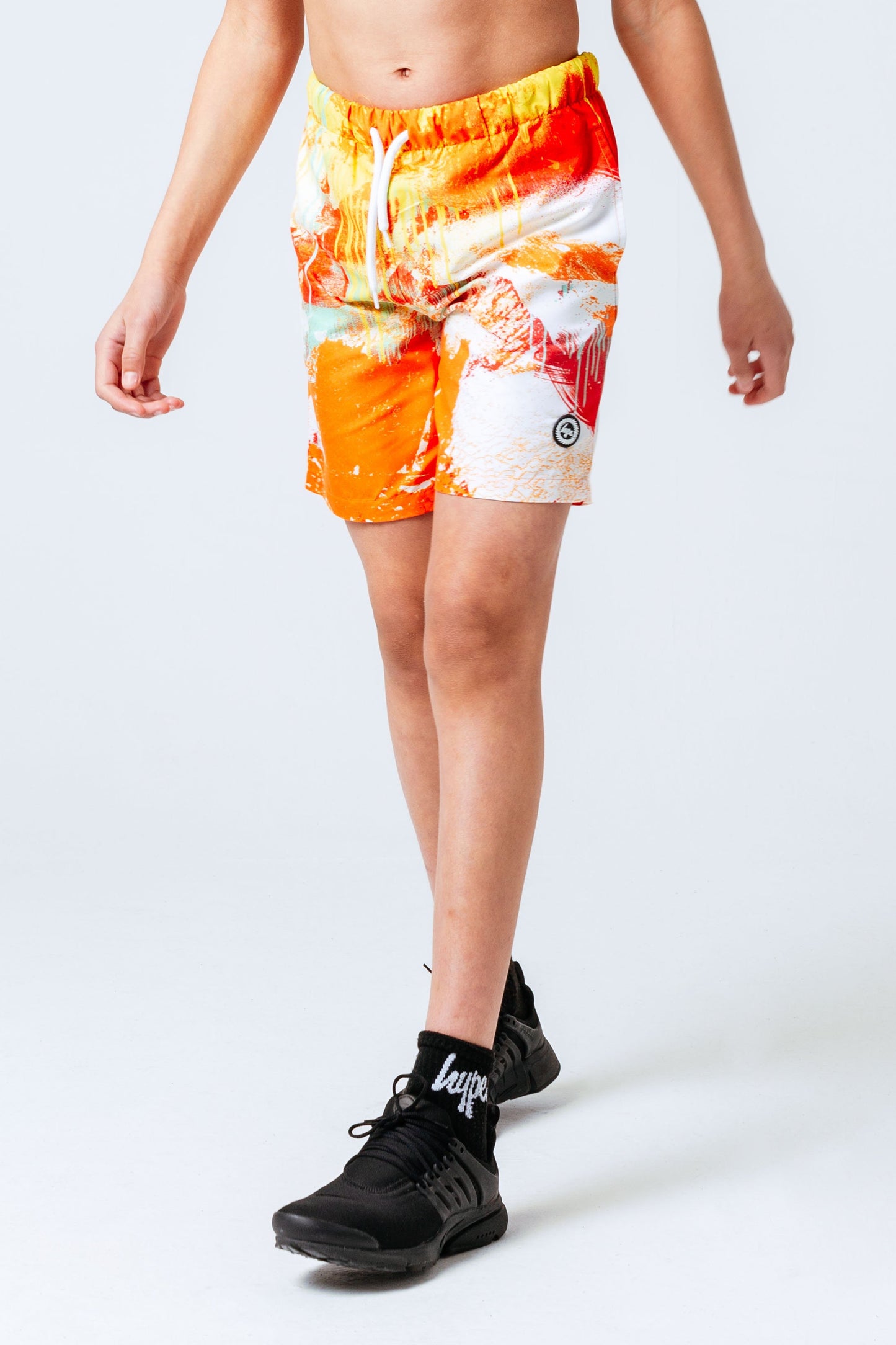 HYPE ORANGE SPRAY KIDS SWIM SHORTS